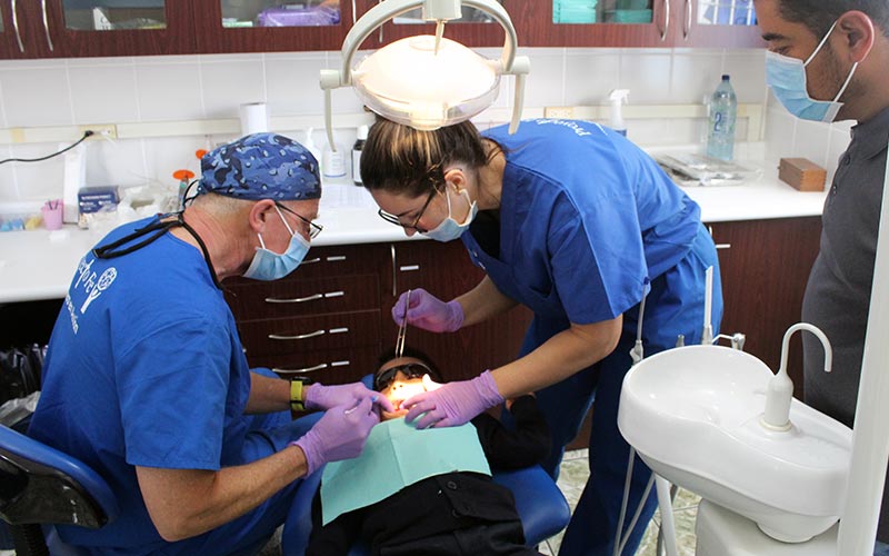 two dental team members at work