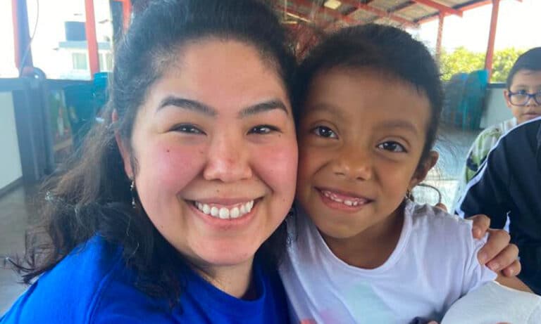 lady smiles with child